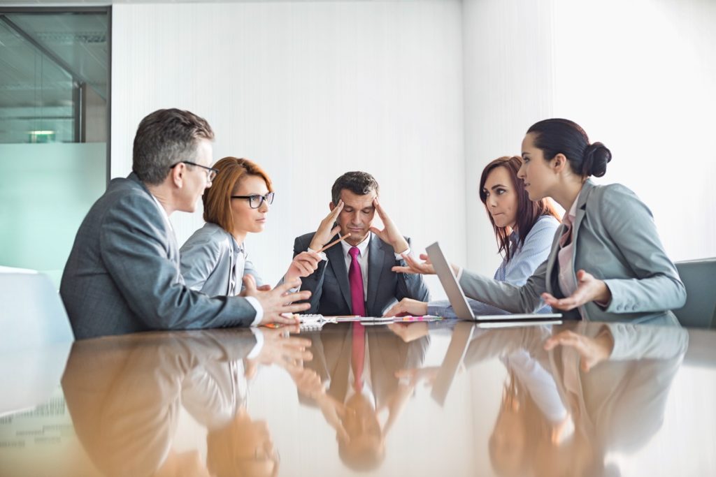 Businesspeople arguing in meeting