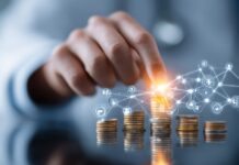 Hand stacking coins with digital network icons representing financial planning and healthcare optimization