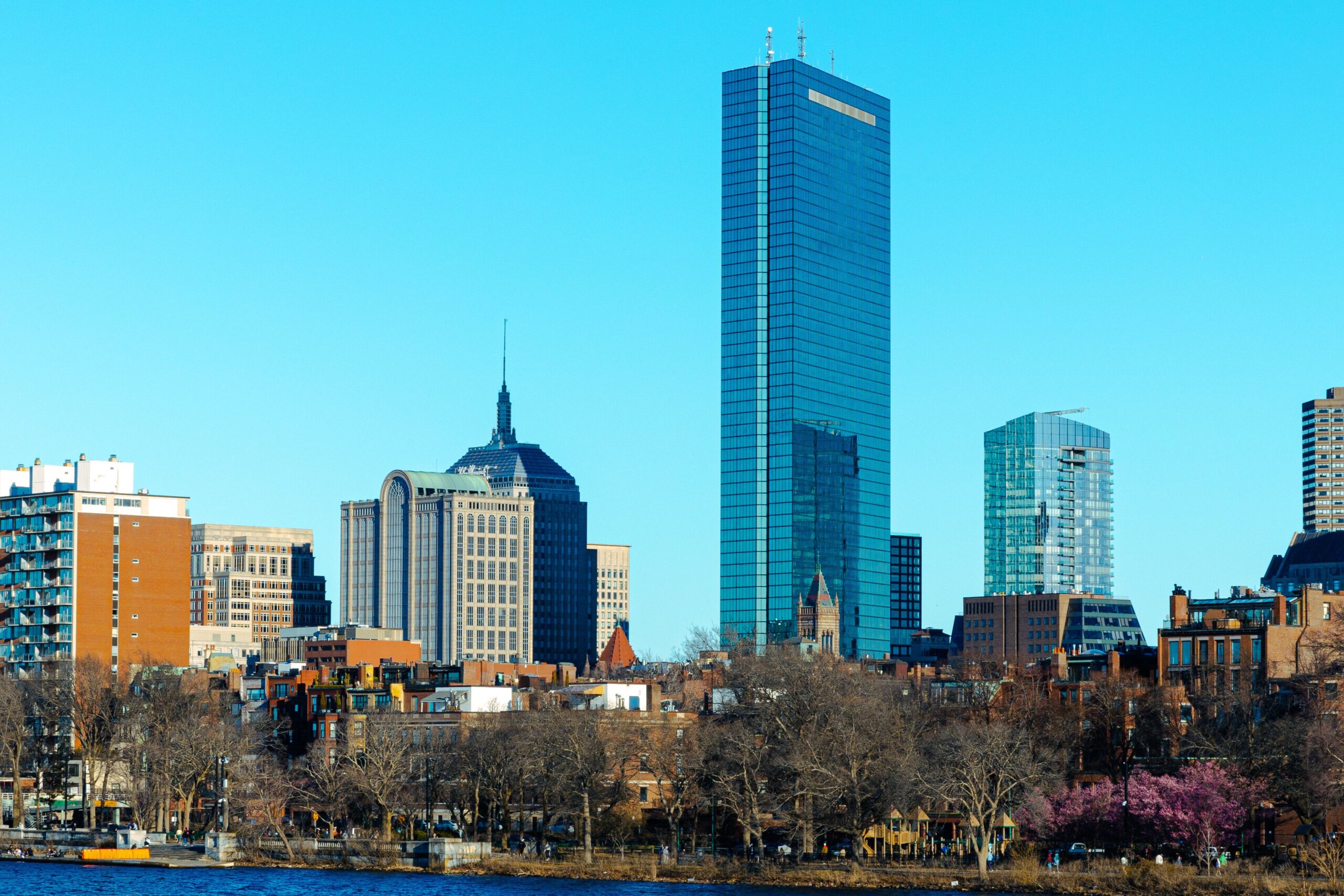 The Overlooked Factors That Shape Employee Satisfaction in Boston Boston skyline featuring the iconic John Hancock Tower
