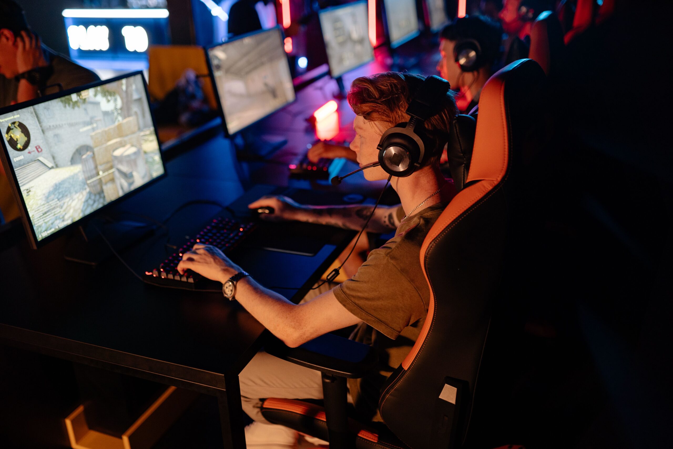 eSports Betting Explained: How Video Games Became a Global Wagering Market Crowd of gamers focused on a competitive esports match in a dimly lit arena