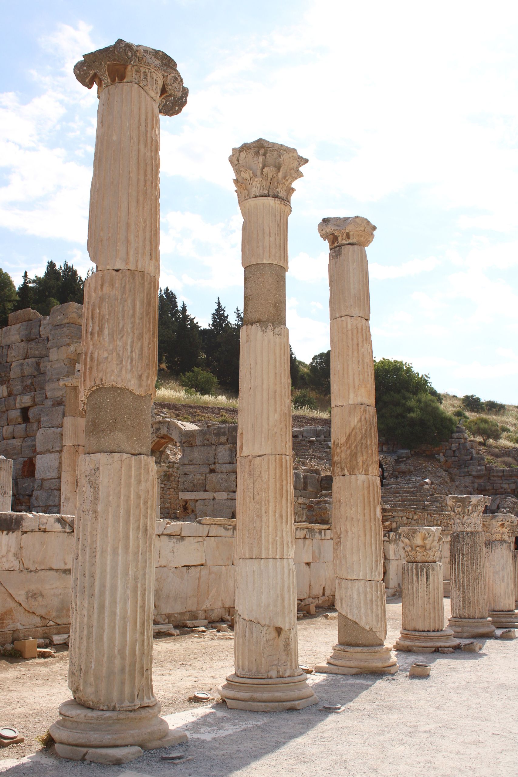 Historic marble columns in ancient Roman ruins under clear skies