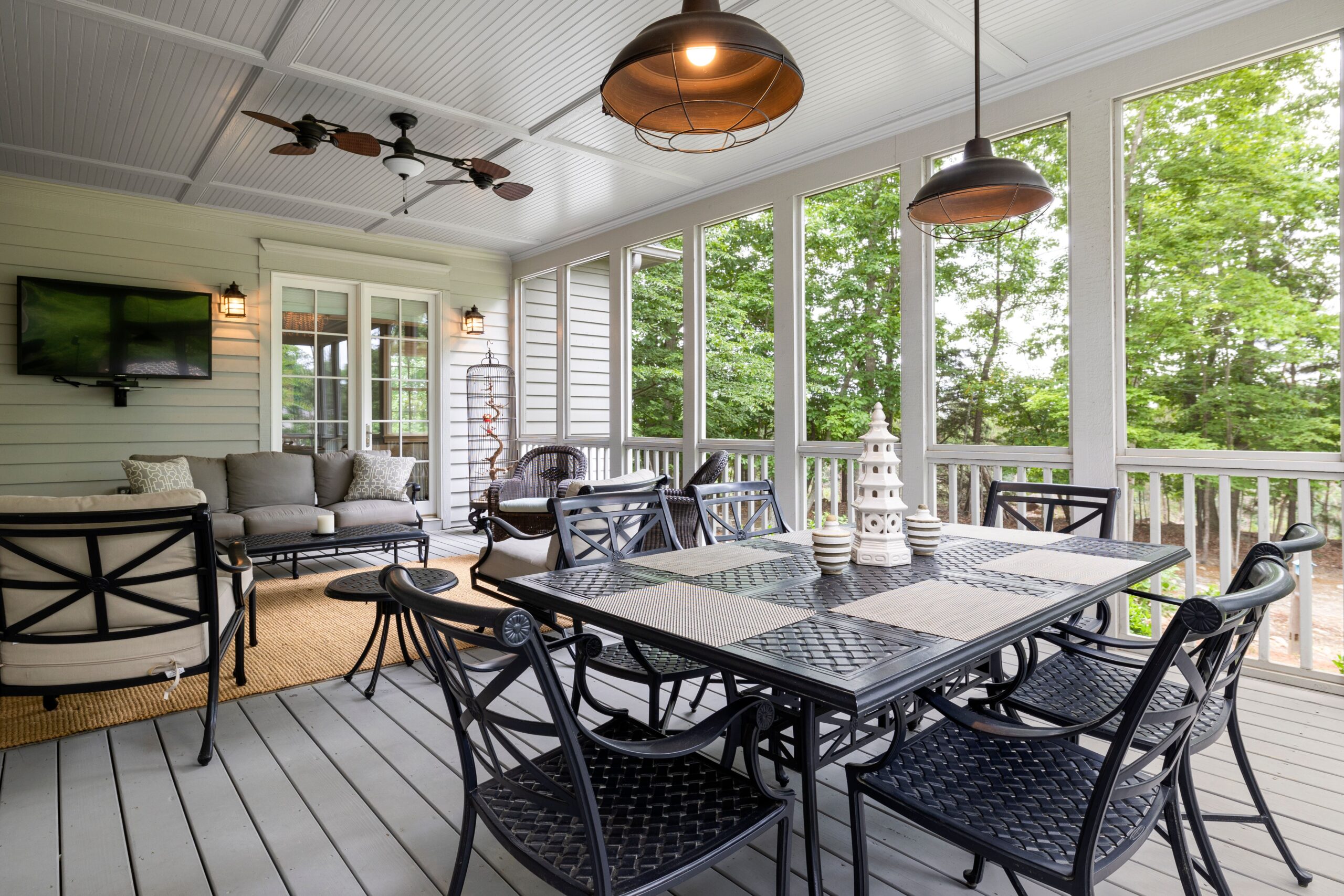Spacious outdoor patio with comfortable seating and a scenic view, illustrating the modern outdoor living room.